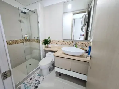 a bathroom with a sink and a toilet and a shower at Beachfront Luxurious Apartment, Palmetto Beach in Cartagena de Indias