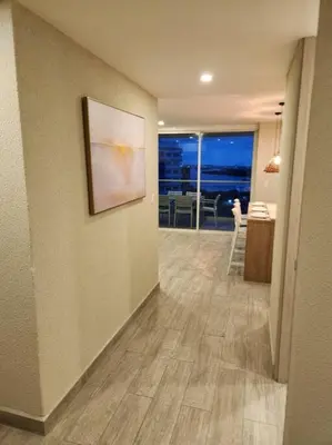 a room with a hallway with a painting on the wall at Dominique luxury 1410 Jacuzzi Privado in Cartagena de Indias