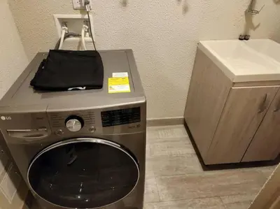 a washing machine in a bathroom with a sink at Dominique luxury 1410 Jacuzzi Privado in Cartagena de Indias