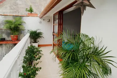 a balcony of a house with plants at Spiritual Luxury 4BR Pool&Roofterrac Getsemani NEW in Cartagena de Indias