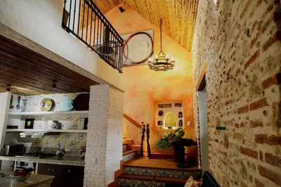 a hallway of a home with a staircase and a ceiling at Spiritual Luxury 4BR Pool&Roofterrac Getsemani NEW in Cartagena de Indias