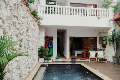 a swimming pool in the courtyard of a house at Spiritual Luxury 4BR Pool&Roofterrac Getsemani NEW in Cartagena de Indias