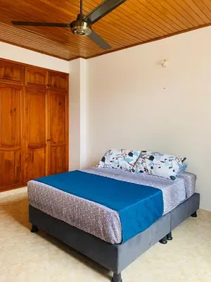 a bed in a bedroom with a ceiling at Castillo de la Popa in Cartagena de Indias