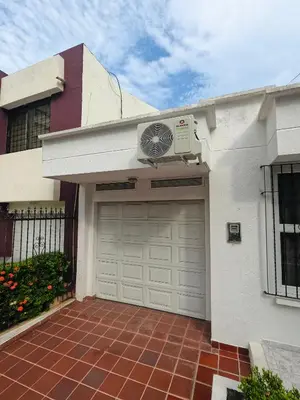 a garage with a air conditioner on the side of a house at Castillo de la Popa in Cartagena de Indias