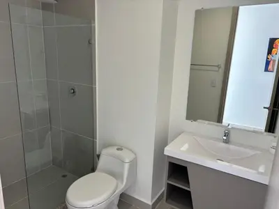 a bathroom with a toilet and a sink and a shower at Cartagena SUNNO BEACH in Cartagena de Indias