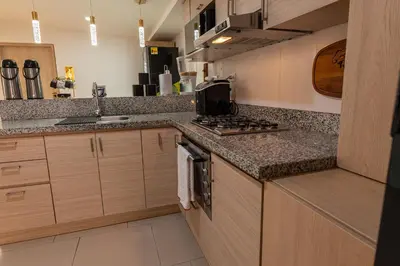 a kitchen with a sink and a stove top oven at Casa Mishka Hotel Boutique Habitación #105 Nuevo Cartagena in Cartagena de Indias