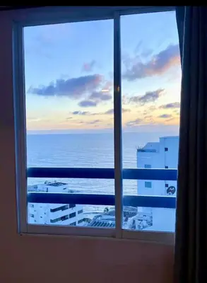 a view of the ocean from a window at APARTAMENTO NUEVO Y ACOGEDOr in Cartagena de Indias