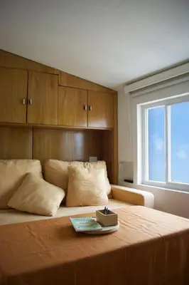 a bedroom with a bed with a tray on it at Loft con terraza y jacuzzi en el centro historico in Cartagena de Indias
