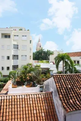 a view of a rooftop with trees and buildings at Loft con terraza y jacuzzi en el centro historico in Cartagena de Indias
