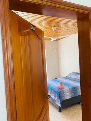 a small bedroom with a bunk bed in a room at Paraiso Pie de la Popa in Cartagena de Indias