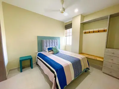 a small bedroom with a bed and a window at Magico Apartaemento Frente al Mar 4 Habitaciones E92 in Coveñas