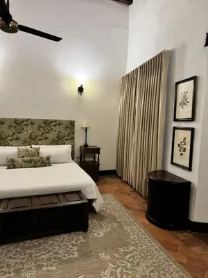 a bedroom with a large bed and a window at Casa Estrella Colonial Mansion in Cartagena de Indias