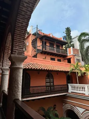 a building with balconies on the side of it at Casa Estrella Colonial Mansion in Cartagena de Indias