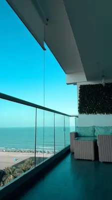 a room with a view of the beach and the ocean at Apartamento con salida privada a la playa en Morros, Cartagena in Cartagena de Indias