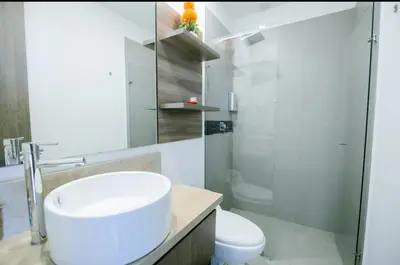 a white bathroom with a sink and a toilet at Apartamento con salida privada a la playa en Morros, Cartagena in Cartagena de Indias