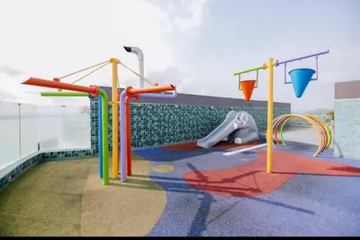 a playground with colorful play equipment on a building at Apartamento con salida privada a la playa en Morros, Cartagena in Cartagena de Indias