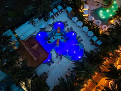 an overhead view of a resort with blue lights at Palmarito Beach Hotel in Tierra Bomba
