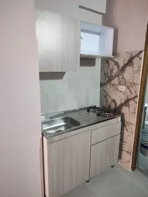a kitchen with a sink and a counter top at Portalon de Magallanes apto para familias in Cartagena de Indias