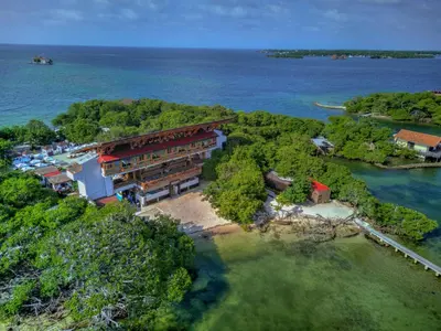 an aerial view of a building on an island in the water at Pao Pao Cartagena in Isla Grande