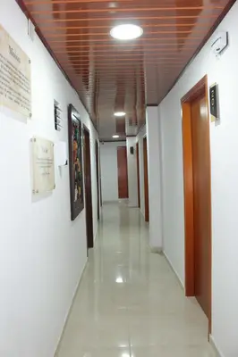 an empty hallway in a hospital with a wooden ceiling at Hospedaje san gabriel in Barranquilla
