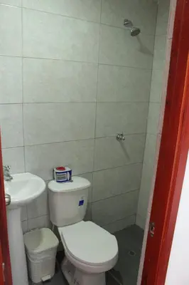 a small bathroom with a toilet and a sink at Hospedaje san gabriel in Barranquilla