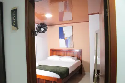 a small bedroom with a bed in a room at Hospedaje san gabriel in Barranquilla