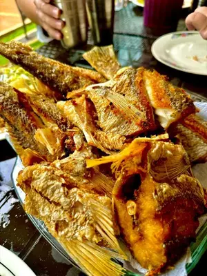 a pile of food on a plate on a table at Paraíso frente al mar in Coveñas
