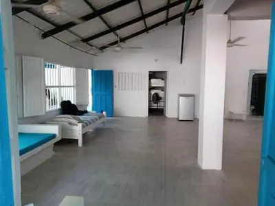 a large living room with a couch and a table at San Jose de los Acuarios in San Antero