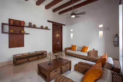 a living room with a couch and a table at Casa Gastelbondo in Cartagena de Indias