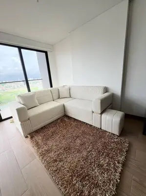 a living room with a white couch and a rug at New Luxury Apartment in Cartagena in Cartagena de Indias