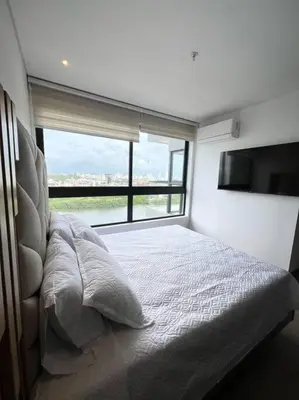 a bedroom with a bed and a large window at New Luxury Apartment in Cartagena in Cartagena de Indias
