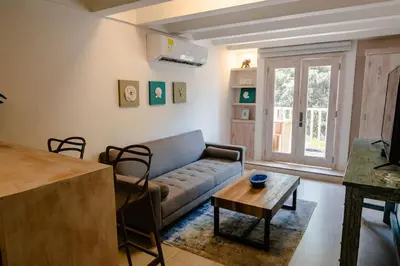 a living room with a couch and a table at Santo Domingo - Centro Histórico in Cartagena de Indias