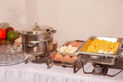 a buffet of food on top of a table at Hotel OR Suite in Barranquilla