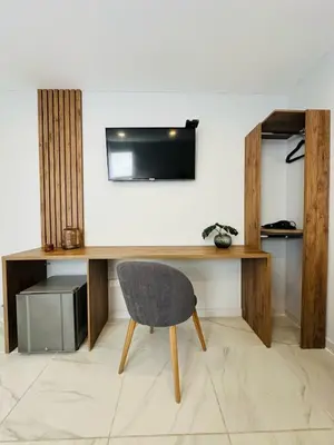 a desk with a chair in a room at Hotel OR Suite in Barranquilla