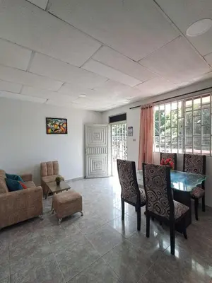a living room with a couch and a table and chairs at LE REEVE, 3BR, Paz, Diseño Bohemio & Grupos in Cartagena de Indias
