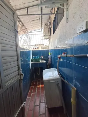 a blue tiled bathroom with a sink and a toilet at LE REEVE, 3BR, Paz, Diseño Bohemio & Grupos in Cartagena de Indias