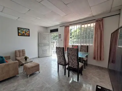 a living room with a table and chairs at LE REEVE, 3BR, Paz, Diseño Bohemio & Grupos in Cartagena de Indias