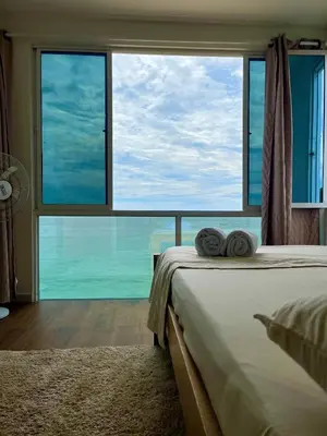 a bedroom with a bed and a large window at Roma apartamento in Playa Blanca