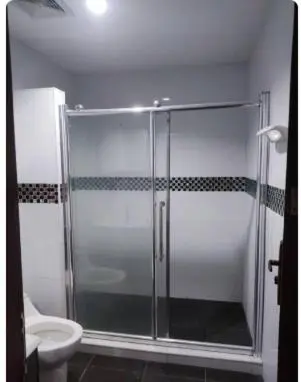 a shower with a glass door in a bathroom at Apartamento Coveñas Castillo Club Cabaña 5 in Coveñas