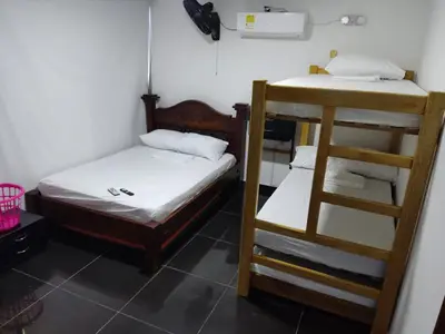 a room with two bunk beds and a ladder at Apartamento Coveñas Castillo Club Cabaña 5 in Coveñas