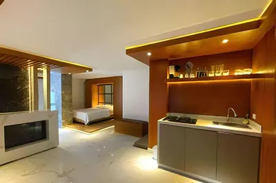 a kitchen with a sink and a stove at Apartaestudios Calle 76 in Barranquilla