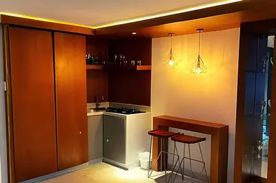 a kitchen with a stove and a stove top oven at Apartaestudios Calle 76 in Barranquilla
