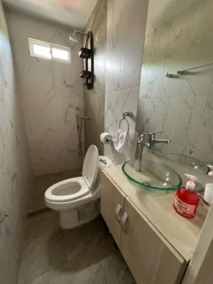 a bathroom with a white toilet and a sink at Apartaestudio Amoblado Tipo Loft en Barrio la Campiña in Cartagena de Indias