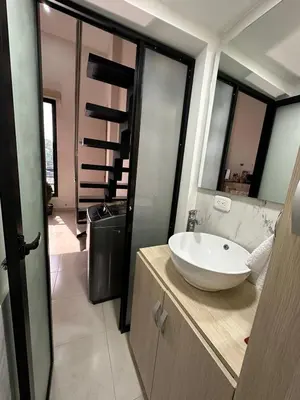 a bathroom with a white sink on a counter at Apartaestudio Amoblado Tipo Loft en Barrio la Campiña in Cartagena de Indias
