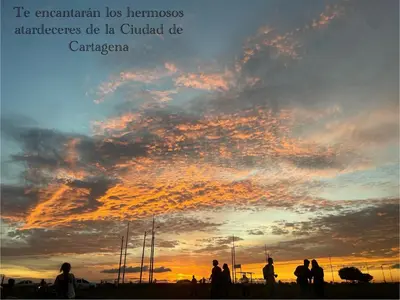 a group of people standing in front of a sunset at Hermoso Apartamento cerca a la playa in Cartagena de Indias