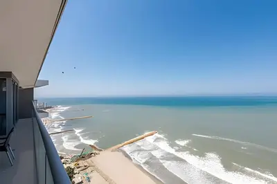 a view of the beach from an airplane window at Awesome Oceanfront “Morros City” 29th floor 2R/3BR in Cartagena de Indias