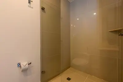 a bathroom with a shower and a toilet paper roll at Awesome Oceanfront “Morros City” 29th floor 2R/3BR in Cartagena de Indias