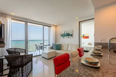a living room with a couch and a table at Awesome Oceanfront “Morros City” 29th floor 2R/3BR in Cartagena de Indias