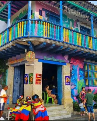 a group of people sitting in front of a building at Cartagena Beach Resort cerca al aereopuerto in Cartagena de Indias