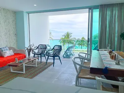 a living room with a view of the ocean at Magico Apartamento Frente al Mar 3 Habitaciones TR22 in Coveñas